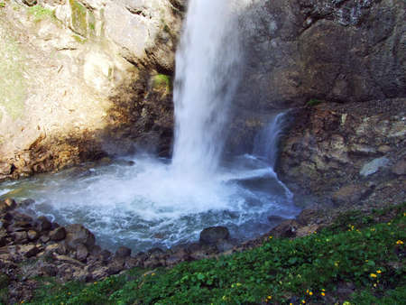 The shady Leuenfall waterfall in Canton St. Gallen, Switzerlandの写真素材