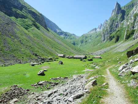Farms and pastures on tableland mountain ranges Alpstein - Canton of St. Gallen, Switzerlandの写真素材