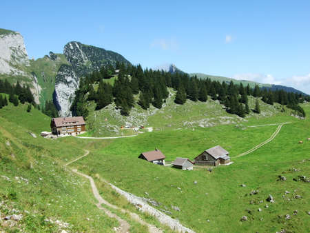 Farms and pastures on tableland mountain ranges Alpstein - Canton of St. Gallen, Switzerlandの写真素材