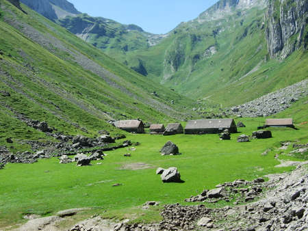 Farms and pastures on tableland mountain ranges Alpstein - Canton of St. Gallen, Switzerlandの写真素材