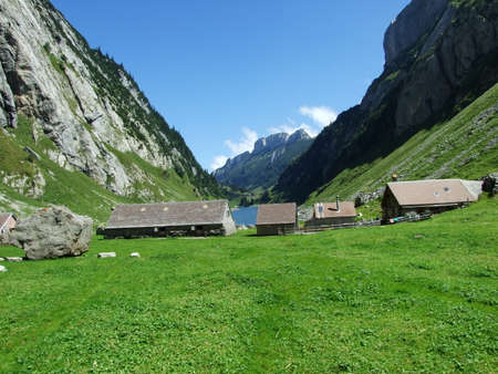Farms and pastures on tableland mountain ranges Alpstein - Canton of St. Gallen, Switzerlandの写真素材