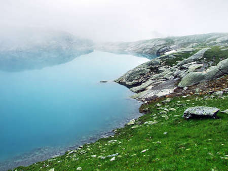 Alpine Lake Schottensee under the Pizol peak in the mountain range Glarus Alps - Canton of St. Gallen, Switzerlandの写真素材