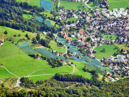 The town of Walenstadt on the shore of Lake Walensee and in the valley of Seez river or in the valley of Seeztal - Canton of St. Gallen, Switzerlandの写真素材