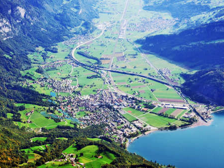 The town of Walenstadt on the shore of Lake Walensee and in the valley of Seez river or in the valley of Seeztal - Canton of St. Gallen, Switzerlandの写真素材