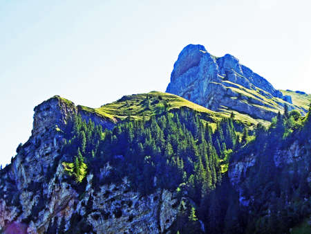 Alpine peak Margelchopf above the Voralpsee lake and the Alviergruppe mountain range - Canton of St....