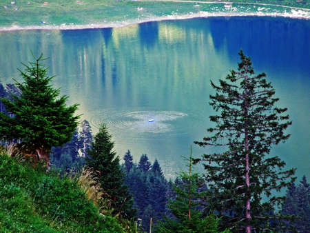 Alpine lake Voralpsee in the mountain range Alviergruppe and above Grabs settlement in the Rhine...