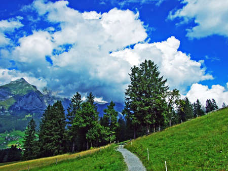 Beautiful clouds above the alpine mountain massif Alpstein and the Thur River valley - Canton of St. Gallen, Switzerlandの写真素材