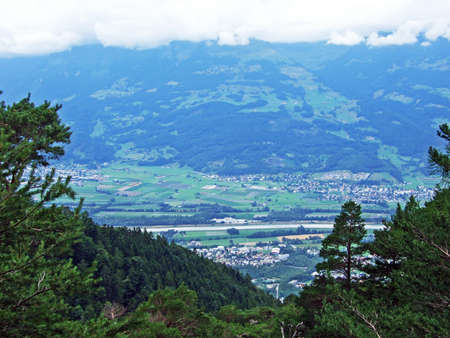 View of the fertile agricultural fields of Liechtenstein and Switzerland in the Rhine river valley...