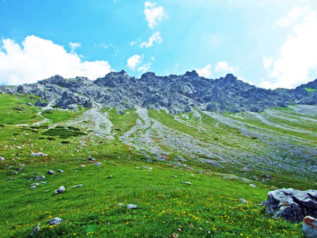 Rocks and stones of the Liechtenstein Alps mountain range and over the Malbuntal alpine valley - Malbun, Liechtensteinの写真素材