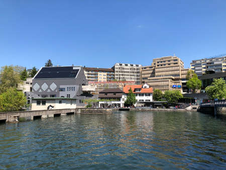 Business and residential buildings along the Limmat River in the city of Zurich, Switzerlandの写真素材