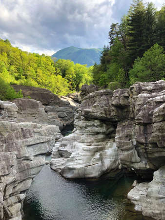 Granite rock formations in the Maggia river in the Maggia Valley or Valle Maggia, Tegna - Canton of Ticino, Switzerlandの写真素材