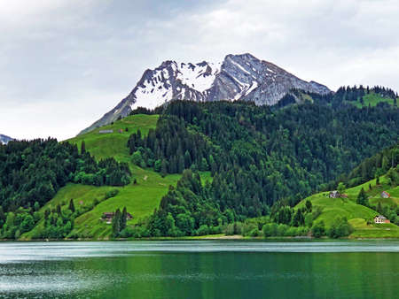 Turner and Diethelm Mountains above the valley Wagital or Waegital and alpine Lake Wagitalersee...