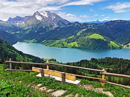 Panoramic view of the Alpine lake Wagitalersee (Waegitalersee), the Wagital or Waegital valley, and the snowy peaks Turner and Diethelm, Innerthal - Canton of Schwyz, Switzerland (Schweiz)の写真素材