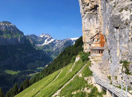 Landscape of the mountain Ebenalp and the mountain restaurant under the Ascher cliff in the...