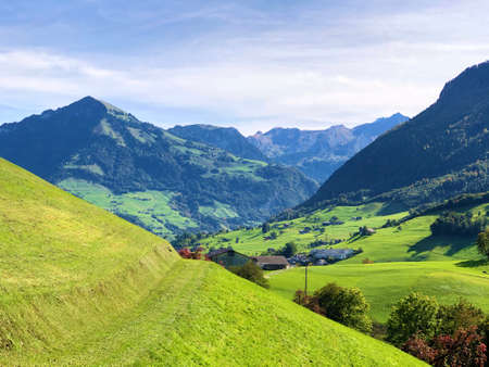 Pastures and meadows on the slopes over the Lake Lucerne or Vierwaldstaetersee lake (Vierwaldstattersee) and Alpnachersee Lake, Alpnach - Canton of Obwalden, Switzerland / Schweizの写真素材
