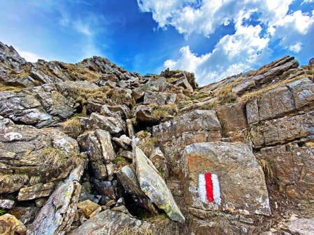 Mountaineering signposts and markings on peaks and slopes of the Pilatus mountain range and in the...