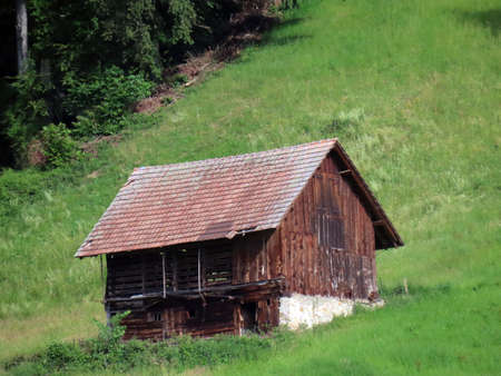 Traditional rural architecture and family livestock farms on the slopes of the Pilatus mountain massif, Alpnach - Canton of Obwalden, Switzerland (Kanton Obwald, Schweiz)の写真素材
