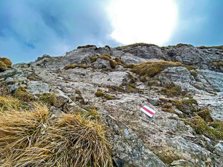 Mountaineering signposts and markings on peaks and slopes of the Pilatus mountain range and in the...