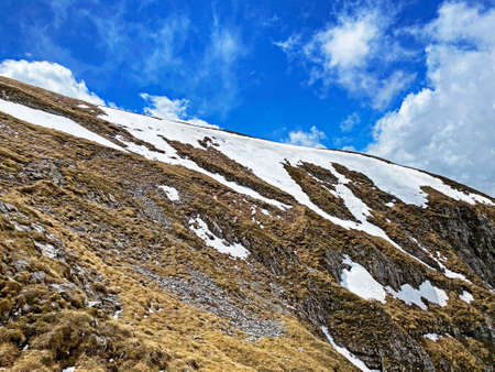 Alpine spring atmosphere with the last remnants of winter and snow on the slopes of the Pilatus...