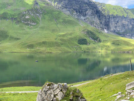 The alpine lake Melchsee or Melch Lake in the Uri Alps mountain massif, Kerns - Canton of Obwalden, Switzerland (Kanton Obwald, Schweiz)の写真素材