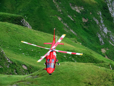 Rega - Swiss Air-Rescue or Swiss Air-Ambulance Helicopter - Die Rega Rettungshelikopter (Rettungsflugwacht und Garde AeriÃ¨nne), Innertkirchen - Canton of Bern, Switzerland (Kanton Bern, Schweiz)のeditorial素材