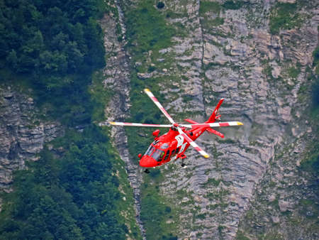 Rega - Swiss Air-Rescue or Swiss Air-Ambulance Helicopter - Die Rega Rettungshelikopter (Rettungsflugwacht und Garde AeriÃ¨nne), Innertkirchen - Canton of Bern, Switzerland (Kanton Bern, Schweiz)のeditorial素材