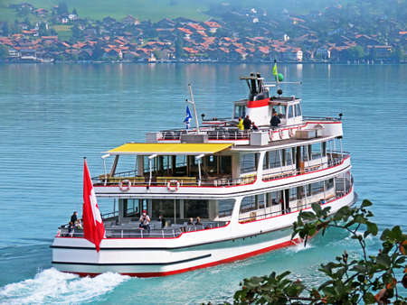 Tourist passenger boats across Lake Brienz (Brienzersee) on the ferry line Giessbach See - Brienz - Canton of Bern, Switzerland (Kanton Bern, Schweiz)のeditorial素材