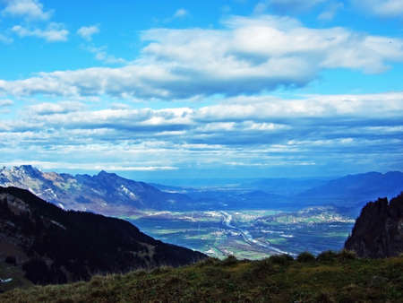 Beautiful wondrous clouds in the autumn Swiss sky above the Rhine valley and the Alpstein massif,...