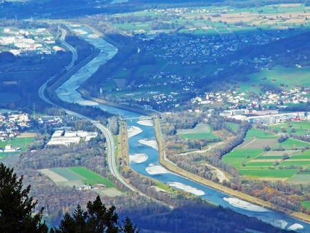 The famous view of the Rhine valley (Rheintal) from the slopes of the Sevelerberg and Werdenberg mountains, Sevelen - Canton of St. Gallen, Switzerland (Schweiz)の写真素材