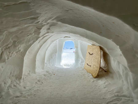 Tunnel dug through deposits of fresh snow above the Glacier du Sex Rouge in the alpine mountain...