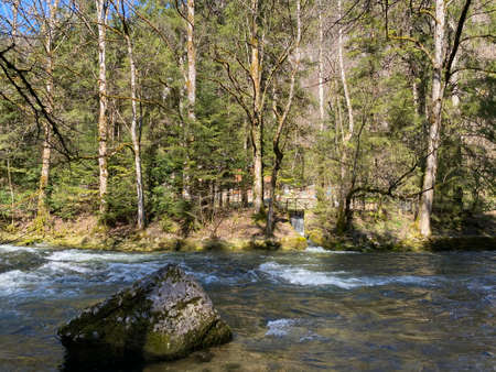 The course of the river Orbe between the cave or spring and the settlement of Vallorbe (der Fluss Orbe or le fleuve de l'Orbe), Vallorbe - Canton of Vaud, Switzerland (Kanton Waadt, Schweiz)の写真素材