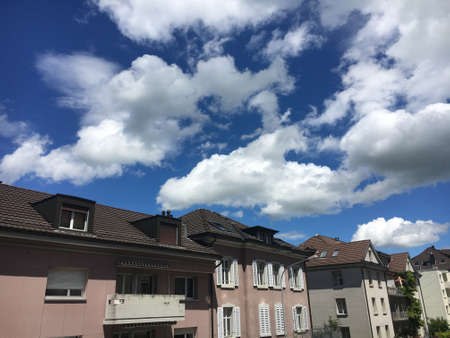 Pure white spring clouds in the clear sky above the Swiss city of St. Gallen, Switzerland (Schweiz)