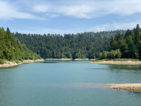Artificial reservoir Lake Lokve or Artificial accumulation Lokvarsko Lake - Gorski kotar, Croatia (Lokvarsko jezero ili umjetno akumulacijsko Omladinsko jezero, Lokve - Gorski kotar, Hrvatska)の写真素材
