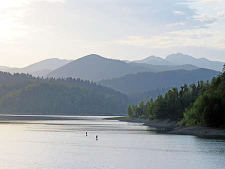 Artificial reservoir Lake Lokve or Artificial accumulation Lokvarsko Lake - Gorski kotar, Croatia (Lokvarsko jezero ili umjetno akumulacijsko Omladinsko jezero, Lokve - Gorski kotar, Hrvatska)の写真素材