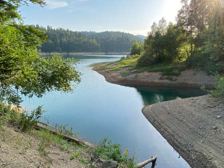 Artificial reservoir Lake Lokve or Artificial accumulation Lokvarsko Lake - Gorski kotar, Croatia (Lokvarsko jezero ili umjetno akumulacijsko Omladinsko jezero, Lokve - Gorski kotar, Hrvatska)の写真素材