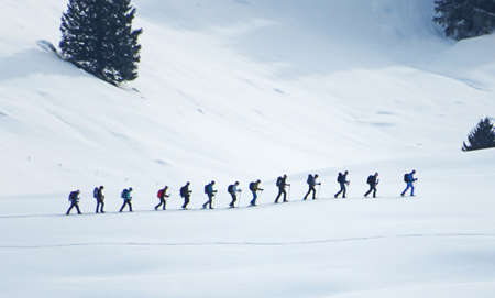 Hikers and walkers on the beautiful idyllic fresh snow of the Swiss Alps, SchwÃ¤galp mountain pass - Canton of Appenzell Ausserrhoden, Switzerland (Schweiz)のeditorial素材
