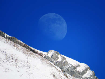 Winter month on the snowy alpine peaks of the Alpstein mountain range above the Toggenburg valley, Alt St. Johann - Obertoggenburg, Switzerland (Schweiz)の写真素材
