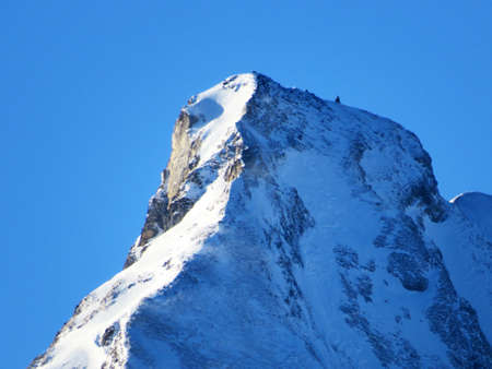 Snow-capped alpine peak FrÃ¼msel (Fruemsel or Frumsel) in the Churfirsten mountain range, between...