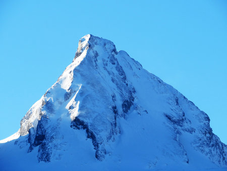 Snow-capped alpine peak FrÃ¼msel (Fruemsel or Frumsel) in the Churfirsten mountain range, between the Toggenburg region and Lake Walensee or Lake Walenstadt - Obertoggenburg, Switzerland (Schweiz)の写真素材