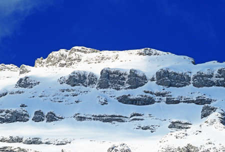 Snow-capped alpine peak Stoss (or Stooss, 2112 m) in Alpstein mountain range and in Appenzell Alps massif, Unterwasser - Canton of St. Gallen, Switzerland (Schweiz)の写真素材