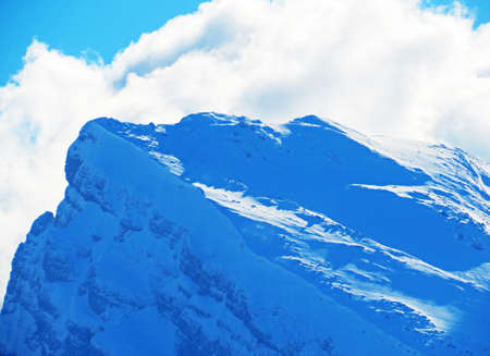 Snow-capped alpine peak Brisi (2278 m) in the Churfirsten mountain range, between the Toggenburg region and Lake Walensee or Lake Walenstadt - Obertoggenburg, Switzerland (Schweiz)の写真素材
