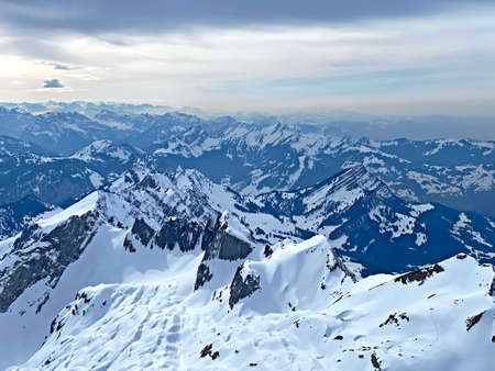 View of the snowy alpine peaks from SÃ¤ntis, the highest peak of the Alpstein mountain range in...