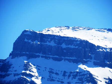 Rocky peak VrenelisgÃ¤rtli (GlÃ¤rnisch) or Vrenelisgaertli (Glaernisc) in Glarus Alps mountain range, over the KlÃ¶ntalersee reservoir lake and KlÃ¶ntal alpine valley - Canton of Glarus, Switzerlandの写真素材