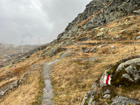 Hiking trails or mountaineering routes in the autumn Swiss Alpine environment and in the St. Gotthard pass (Gotthardpass) mountain area, Airolo - Canton of Ticino (Tessin)の写真素材