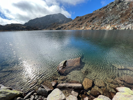 A crystal clear alpine lakes Laghi d'Orsirora during a beautiful autumn day in the mountainous area of the St. Gotthard Pass (Gotthardpass), Airolo - Canton of Ticino (Tessin)の写真素材