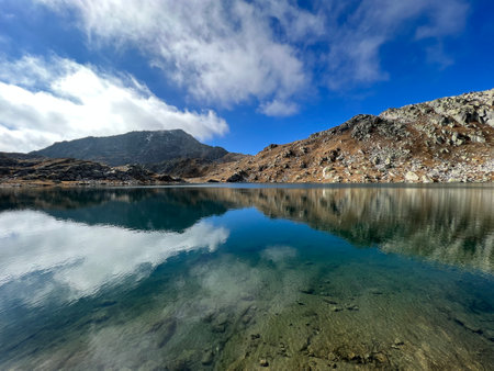 A crystal clear alpine lakes Laghi d'Orsirora during a beautiful autumn day in the mountainous area of the St. Gotthard Pass (Gotthardpass), Airolo - Canton of Ticino (Tessin)の写真素材