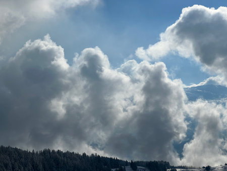 Beautiful low winter clouds and fog condensation in the Swiss Alps during a polar cold snap, Amden - Canton of St. Gallen, Switzerland / Schweizの写真素材
