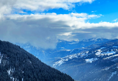 Beautiful low winter clouds and fog condensation in the Swiss Alps above the tourist resorts of Valbella and Lenzerheide in the Swiss Alps - Canton of Grisons, Switzerland (Schweizの写真素材