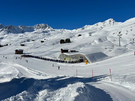 Carmenna high speed chairlift (detachable) with bubble (Carmenna - 4er Hochgeschwindigkeits-Sesselbahn oder kuppelbar mit Abdeckhauben) in the Swiss resort of Arosa - Switzerlandの写真素材