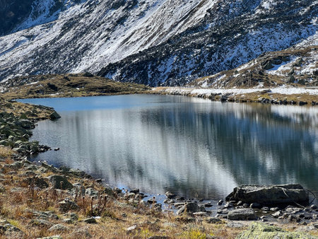 A small alpine lake Lai Nair (Black Lake or Schwarzer See) on the Swiss mountain road pass Fluela (FlÃ¼elapass), Davos - Canton of Grisons, Switzerland (Kanton GraubÃ¼nden, Schweiz)の写真素材